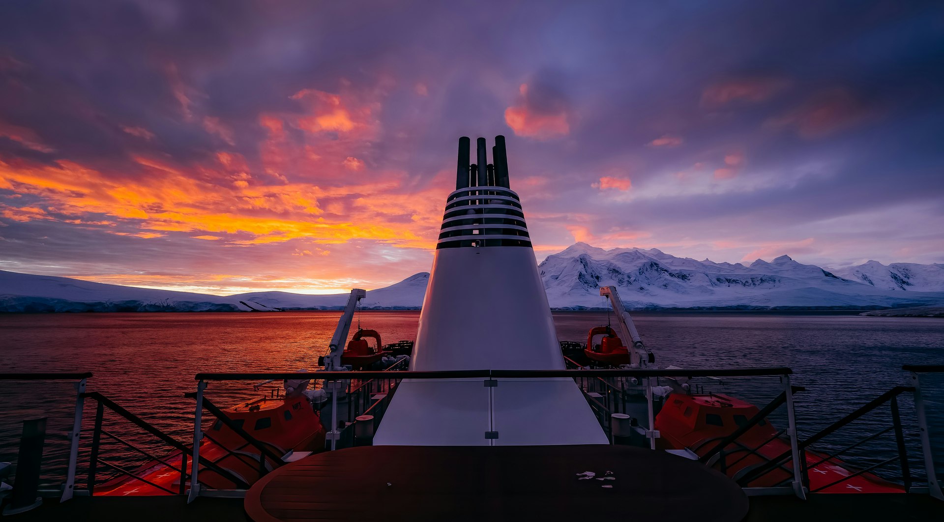 Website_Screen-The-Greg-Mortimer-in-Beautiful-Sunset-Port-Lockroy-Antarctica-Matt-Horspool.jpeg