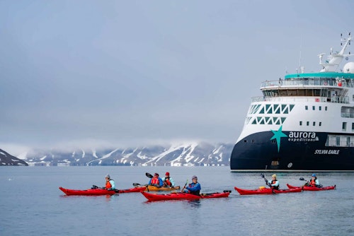 Group of kayakers paddling away from the Sylvia Earle, Samarinbreen, Svalbard, Lina Stock